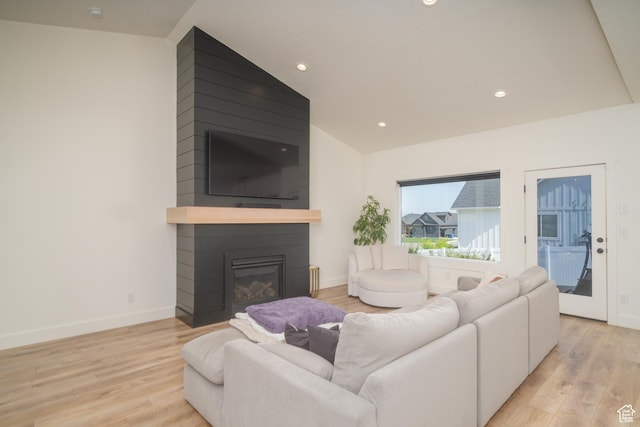 142 N 1100 E, Hyde Park, UT 84318 - living room with light wood finished floors, a fireplace, recessed lighting, and vaulted ceiling
