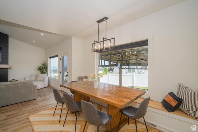 142 N 1100 E, Hyde Park, UT 84318 - dining room with light wood-style flooring, vaulted ceiling, a chandelier, and recessed lighting