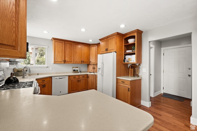 2188 E Country View Ln, Cottonwood Heights, UT 84121 - kitchen featuring white appliances, light countertops, wood finished floors, recessed lighting, and brown cabinets