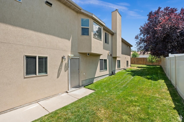 2188 E Country View Ln, Cottonwood Heights, UT 84121 - rear view of property with a fenced backyard, a chimney, and stucco siding