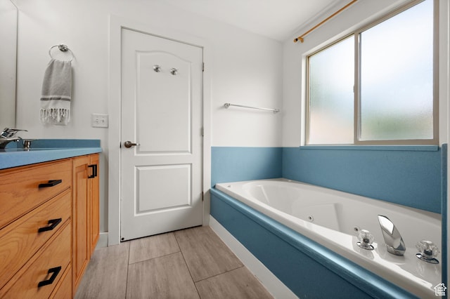 2188 E Country View Ln, Cottonwood Heights, UT 84121 - full bath featuring a whirlpool tub, wood finished floors, and vanity