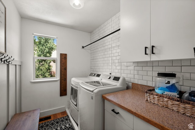 2188 E Country View Ln, Cottonwood Heights, UT 84121 - laundry room featuring washing machine and clothes dryer, cabinet space, and wood finished floors
