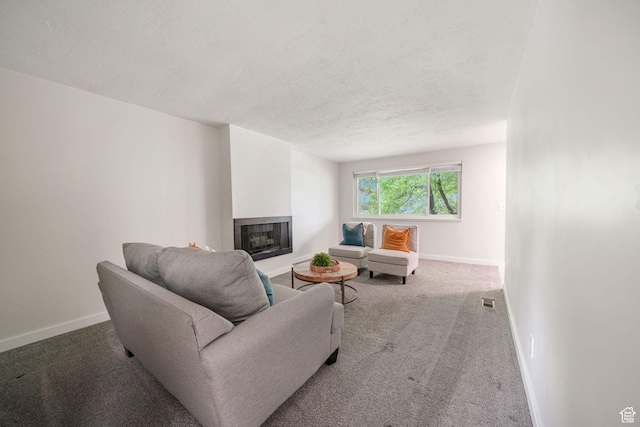 4716 S 700 E Unit 33, Murray, UT 84107 - carpeted living room featuring a fireplace with raised hearth and a textured ceiling