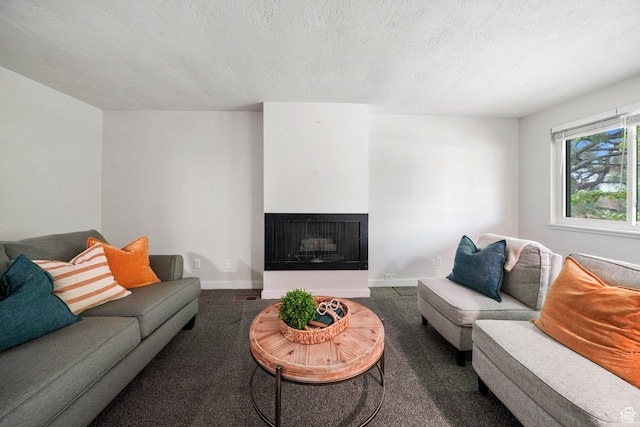 4716 S 700 E Unit 33, Murray, UT 84107 - living area with carpet flooring, a multi sided fireplace, and a textured ceiling