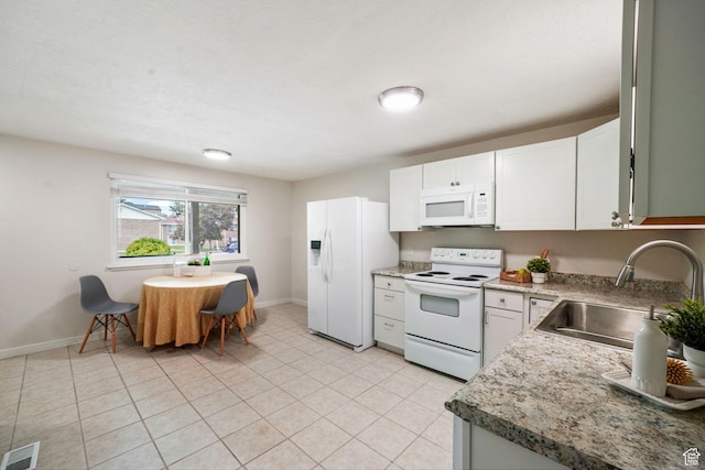 4716 S 700 E Unit 33, Murray, UT 84107 - kitchen featuring white appliances, white cabinets, light tile patterned floors, and light countertops