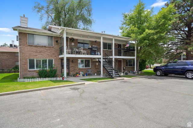 4716 S 700 E Unit 33, Murray, UT 84107 - view of property featuring stairs and uncovered parking