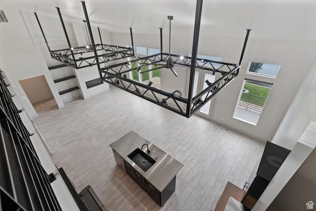 2628 E 40 N Unit 9, Spanish Fork, UT 84660 - unfurnished living room with a towering ceiling and wood finished floors