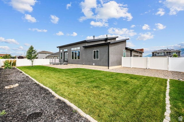 2628 E 40 N Unit 9, Spanish Fork, UT 84660 - back of house with stucco siding and a fenced backyard