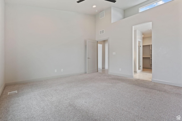 2628 E 40 N Unit 9, Spanish Fork, UT 84660 - empty room featuring ceiling fan, light colored carpet, and a high ceiling