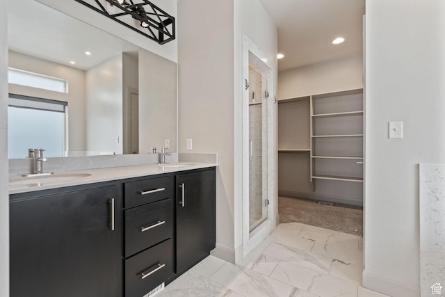 2628 E 40 N Unit 9, Spanish Fork, UT 84660 - bathroom featuring marble finish floors, double vanity, a shower stall, a closet, and recessed lighting