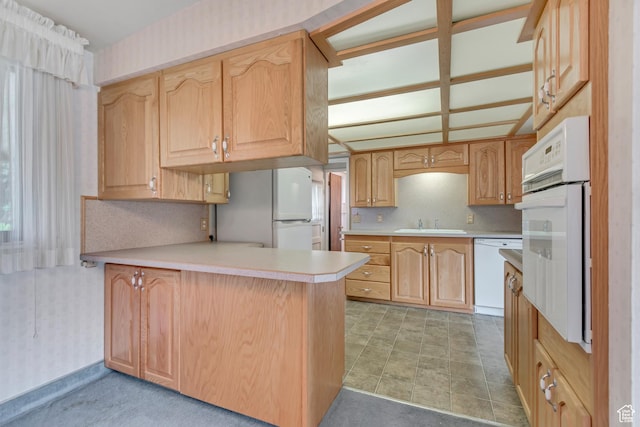 109 W 900 S, Bountiful, UT 84010 - kitchen featuring white appliances, a peninsula, wallpapered walls, and light countertops