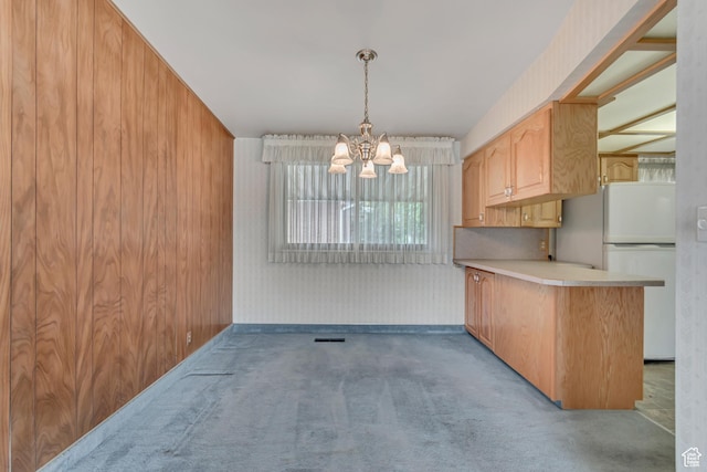 109 W 900 S, Bountiful, UT 84010 - kitchen with freestanding refrigerator, a chandelier, carpet floors, light countertops, and a peninsula