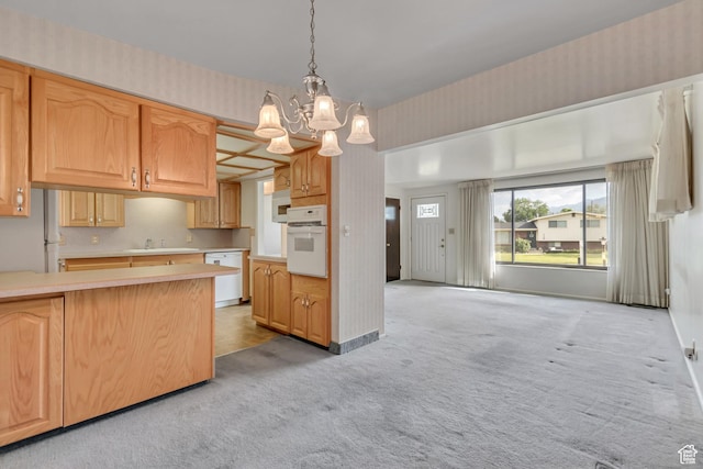 109 W 900 S, Bountiful, UT 84010 - kitchen with white appliances, light colored carpet, a chandelier, light countertops, and wallpapered walls