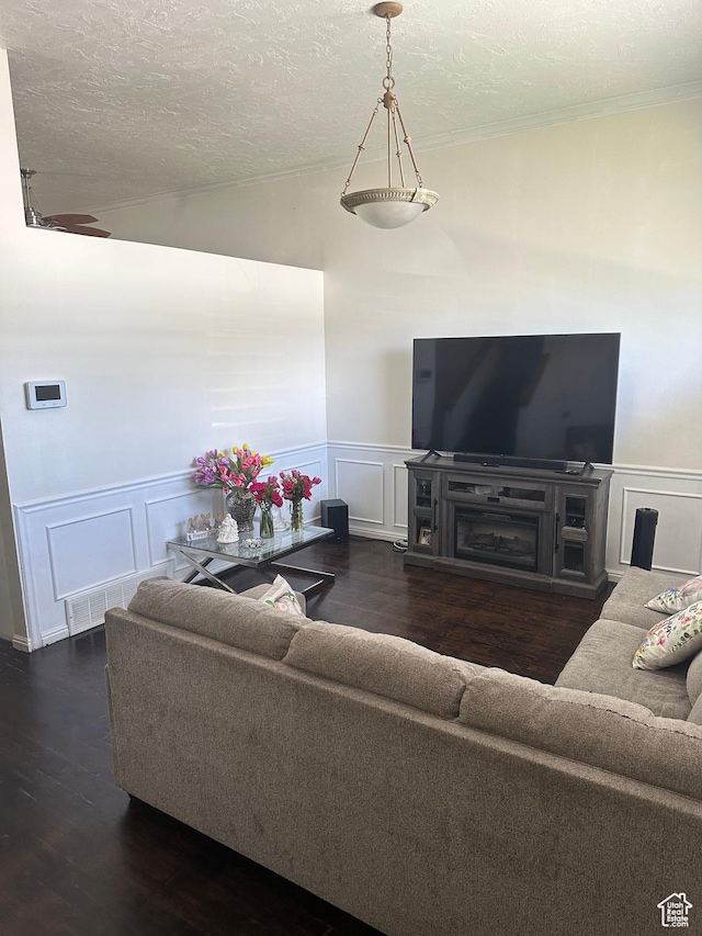 1145 N 560 W, Orem, UT 84057 - living area with a decorative wall, a textured ceiling, wood finished floors, wainscoting, and lofted ceiling
