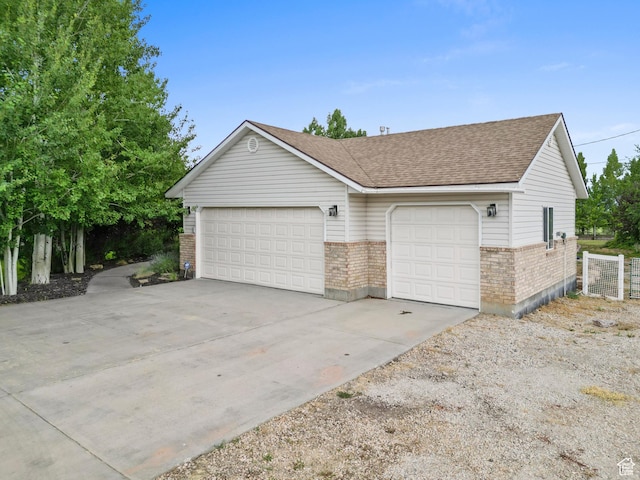 325 W Burgi Ln, Midway, UT 84049 - view of front facade featuring brick siding and roof with shingles