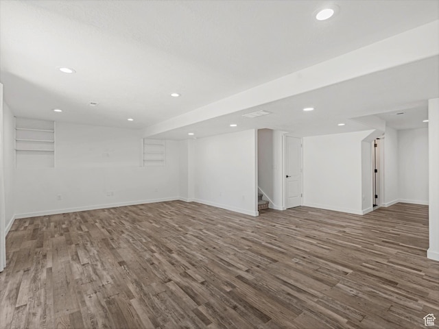1907 E Brooklyn Cir N, Saratoga Springs, UT 84045 - finished below grade area featuring wood finished floors, stairs, and recessed lighting