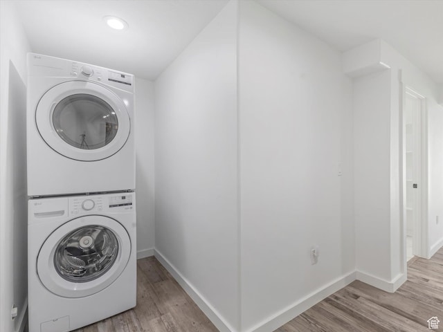 1907 E Brooklyn Cir N, Saratoga Springs, UT 84045 - laundry room featuring stacked washer / dryer, light wood-style flooring, and recessed lighting