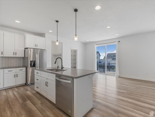 1907 E Brooklyn Cir N, Saratoga Springs, UT 84045 - kitchen featuring stainless steel appliances, recessed lighting, decorative backsplash, light wood finished floors, and white cabinets