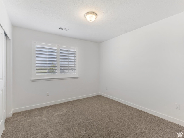 1907 E Brooklyn Cir N, Saratoga Springs, UT 84045 - unfurnished bedroom featuring carpet floors, a closet, and a textured ceiling