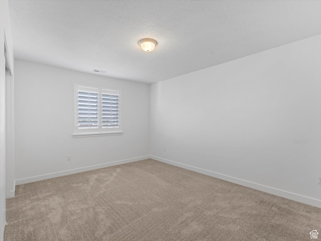 1907 E Brooklyn Cir N, Saratoga Springs, UT 84045 - spare room featuring carpet and a textured ceiling