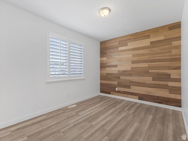 1907 E Brooklyn Cir N, Saratoga Springs, UT 84045 - spare room with wood finished floors and wooden walls