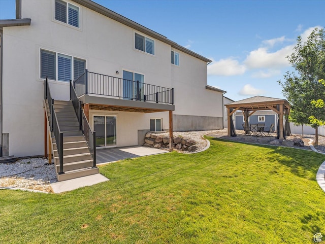 1907 E Brooklyn Cir N, Saratoga Springs, UT 84045 - back of house featuring a gazebo, a patio area, a lawn, stairway, and stucco siding