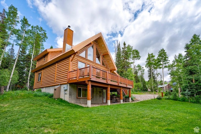 556 N Half Circle Dr, Brian Head, UT 84719 - back of property featuring a deck, a yard, log veneer siding, and a chimney