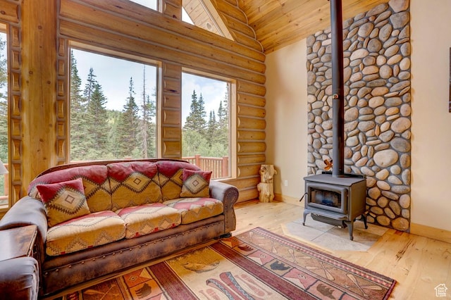 556 N Half Circle Dr, Brian Head, UT 84719 - living area with log walls, a wood stove, wood finished floors, high vaulted ceiling, and wooden ceiling