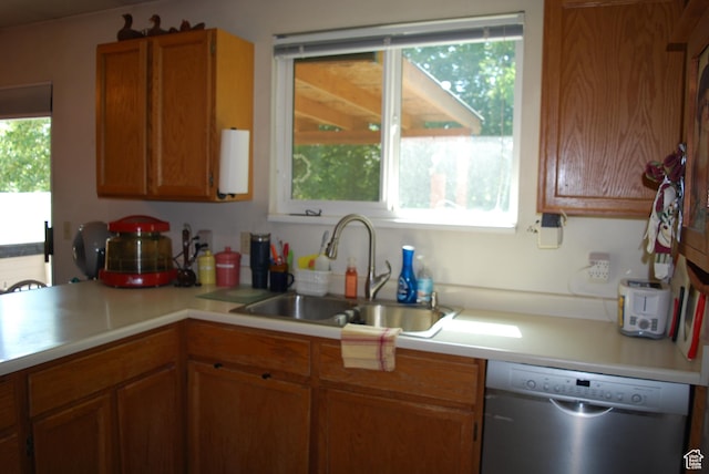 10642 S 1090 E, Sandy, UT 84094 - kitchen with dishwasher, light countertops, and brown cabinetry