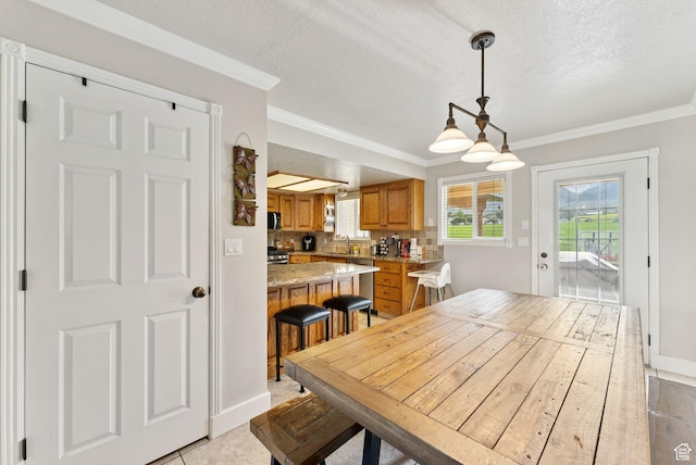 694 E 2350 N, North Ogden, UT 84414 - dining area featuring ornamental molding and a textured ceiling