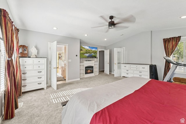 694 E 2350 N, North Ogden, UT 84414 - carpeted bedroom featuring lofted ceiling, a glass covered fireplace, recessed lighting, and a ceiling fan