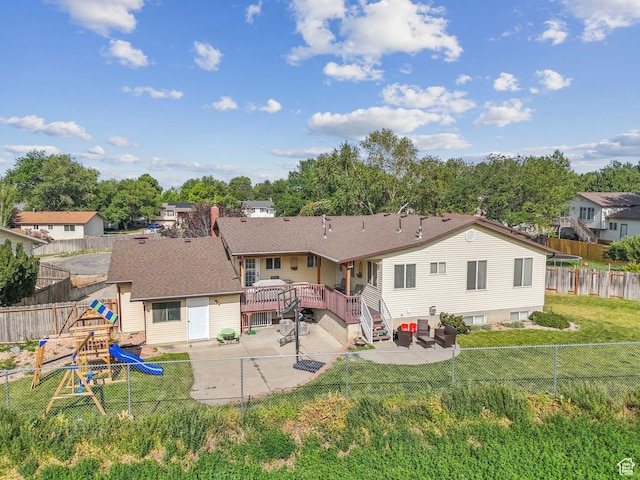 694 E 2350 N, North Ogden, UT 84414 - rear view of property featuring a playground, a patio area, a fenced backyard, a wooden deck, and a residential view