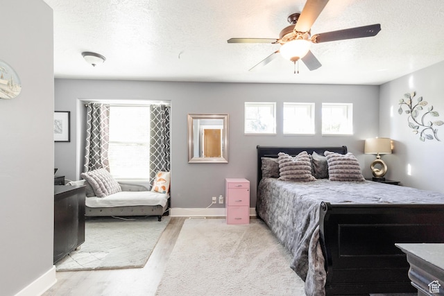 265 W 1010 S, Logan, UT 84321 - bedroom with a textured ceiling, wood finished floors, and ceiling fan