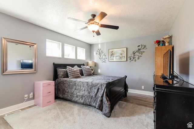 265 W 1010 S, Logan, UT 84321 - bedroom with a textured ceiling, ceiling fan, and light wood-style flooring