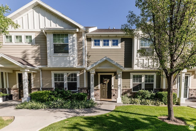 265 W 1010 S, Logan, UT 84321 - multi unit property with board and batten siding, a front yard, and stone siding