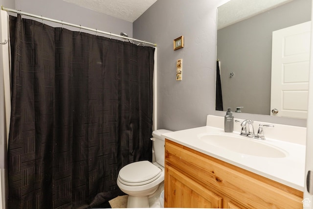 265 W 1010 S, Logan, UT 84321 - full bath featuring vanity, a shower with shower curtain, and a textured ceiling
