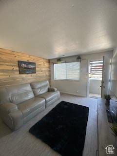 7143 S 2700 W Unit 1, West Jordan, UT 84084 - living room featuring wood walls and plenty of natural light