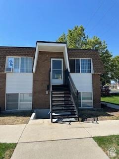 7143 S 2700 W Unit 1, West Jordan, UT 84084 - view of front facade with brick siding and stairs
