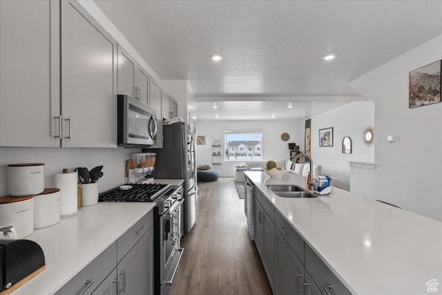1098 E Vessel Ct, Saratoga Springs, UT 84045 - kitchen with appliances with stainless steel finishes, gray cabinets, light countertops, open floor plan, and recessed lighting