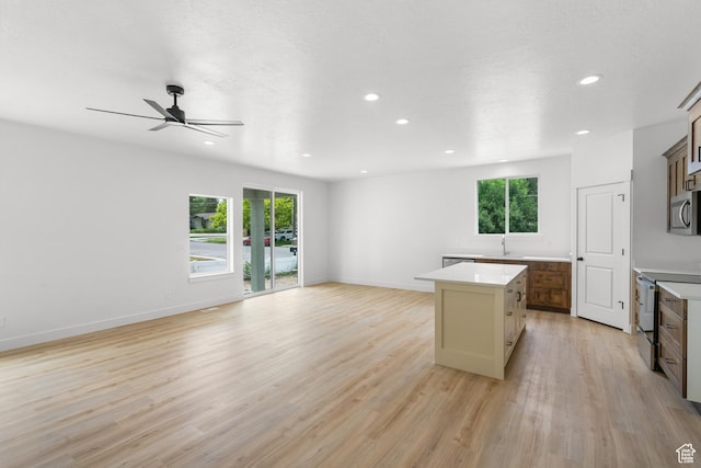 222 E 300 N, Payson, UT 84651 - kitchen with appliances with stainless steel finishes, open floor plan, healthy amount of natural light, a center island, and recessed lighting