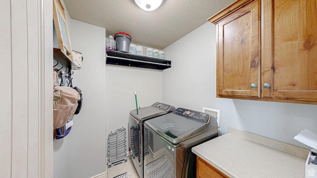 645 Stonebrook Ln, Santaquin, UT 84655 - laundry area featuring cabinet space, washer and dryer, a textured ceiling, and light tile patterned floors