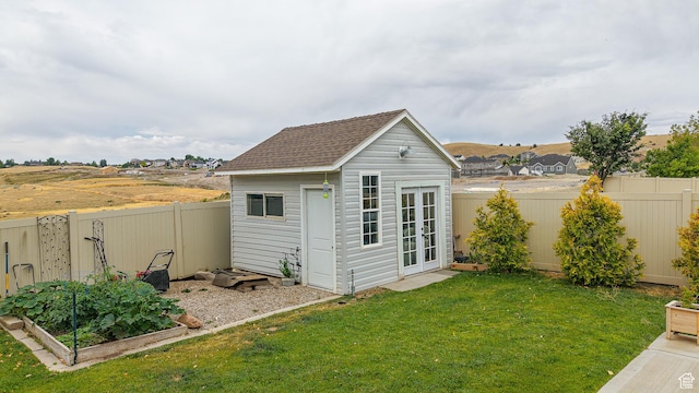 645 Stonebrook Ln, Santaquin, UT 84655 - view of outbuilding with a garden, a fenced backyard, and french doors