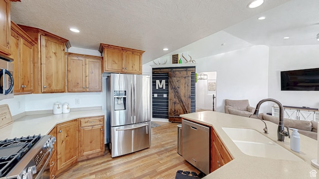 645 Stonebrook Ln, Santaquin, UT 84655 - kitchen with stainless steel appliances, open floor plan, light wood-style flooring, recessed lighting, and light countertops