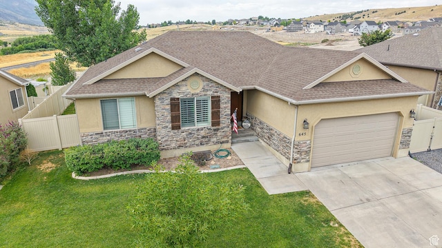 645 Stonebrook Ln, Santaquin, UT 84655 - ranch-style house featuring stone siding, stucco siding, a shingled roof, concrete driveway, and a garage