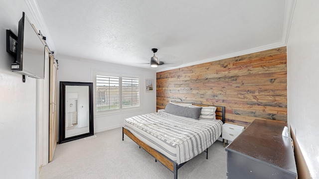 645 Stonebrook Ln, Santaquin, UT 84655 - bedroom with wooden walls, a barn door, light carpet, crown molding, and a ceiling fan