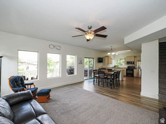 373 N Willow Haven Ave, Lehi, UT 84043 - living area featuring a ceiling fan, dark wood finished floors, and a chandelier