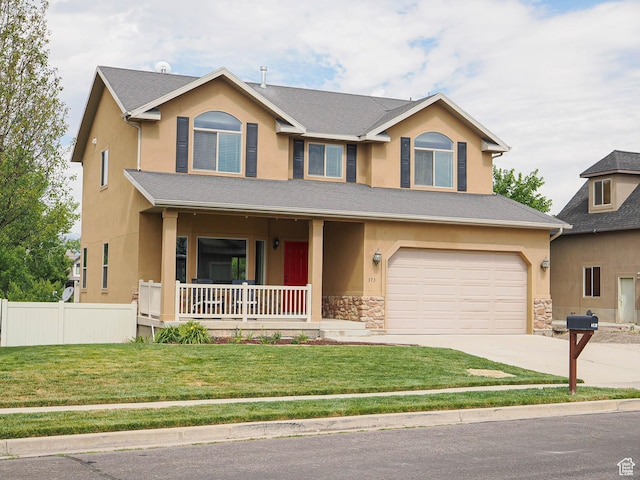 373 N Willow Haven Ave, Lehi, UT 84043 - view of front of house with a porch, stucco siding, concrete driveway, stone siding, and an attached garage