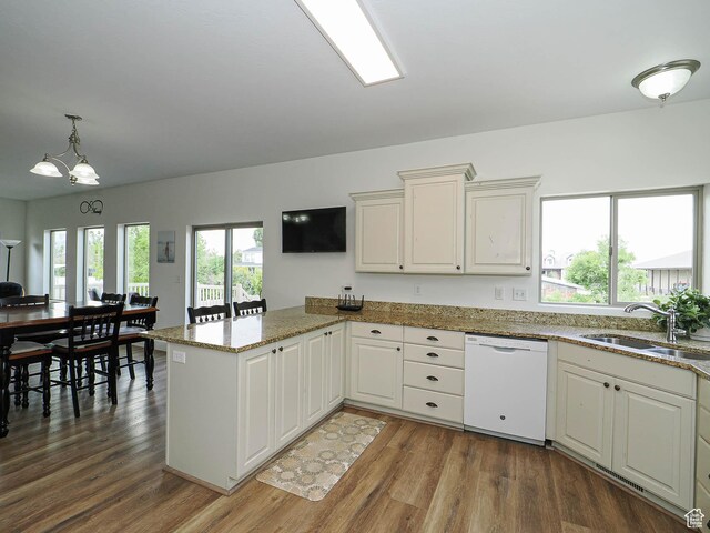373 N Willow Haven Ave, Lehi, UT 84043 - kitchen with dishwasher, a peninsula, wood finished floors, and light stone countertops