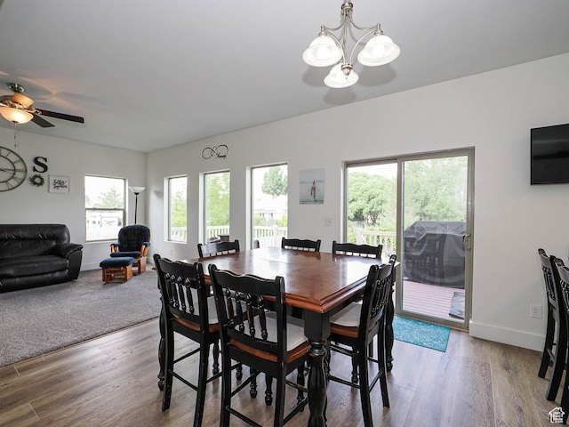 373 N Willow Haven Ave, Lehi, UT 84043 - dining area with healthy amount of natural light, a chandelier, wood finished floors, and ceiling fan