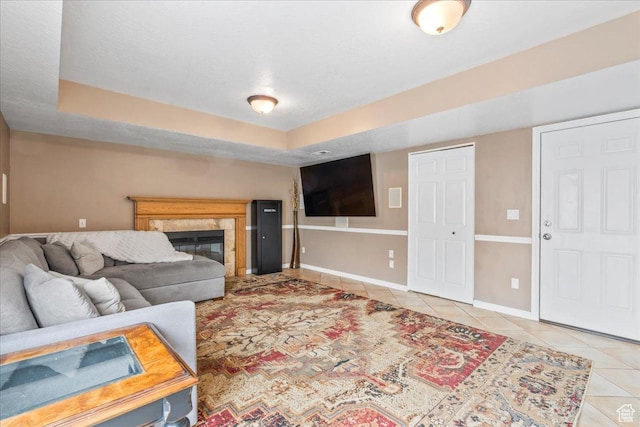 6956 S Firefox Cir, West Jordan, UT 84084 - tiled living room with a high end fireplace and a raised ceiling